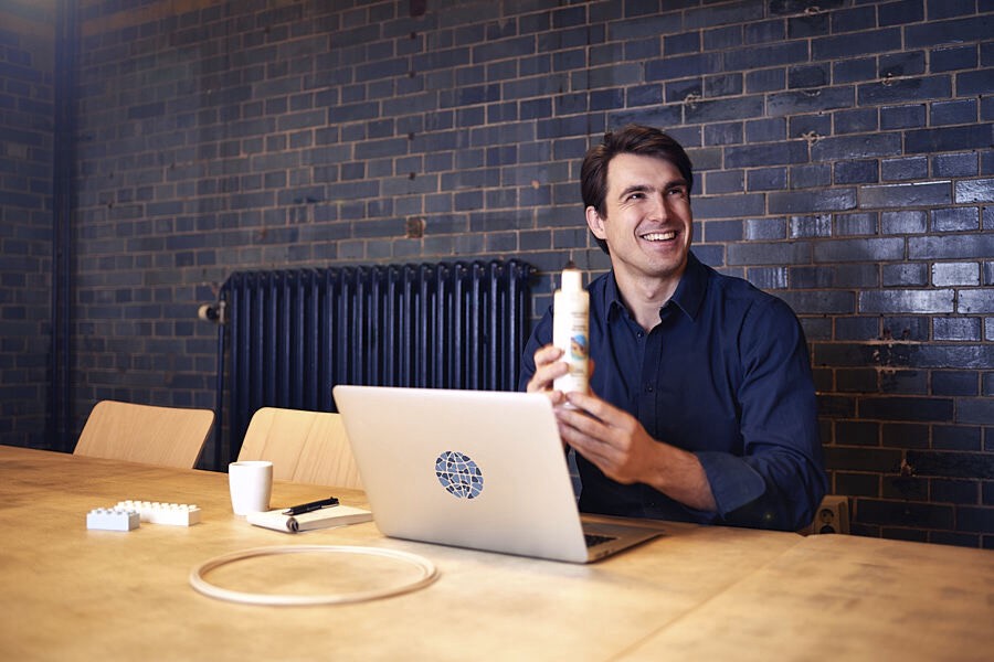 Rick holding a beauty product from a Czech company which he is consulting, containing only natural and biodegradable materials